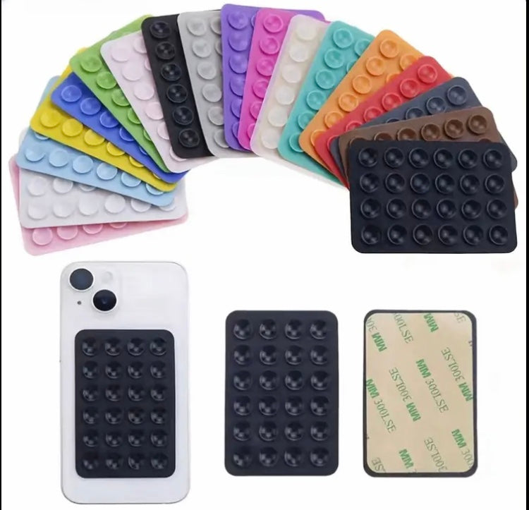 24 Compact Silicone Phone Holders with Suction Cups, Designed for Smartphones And Compatible with Different Surfaces. They Are Sturdy, Waterproof, Easy to Apply, And Have a Non-Slip Feature.