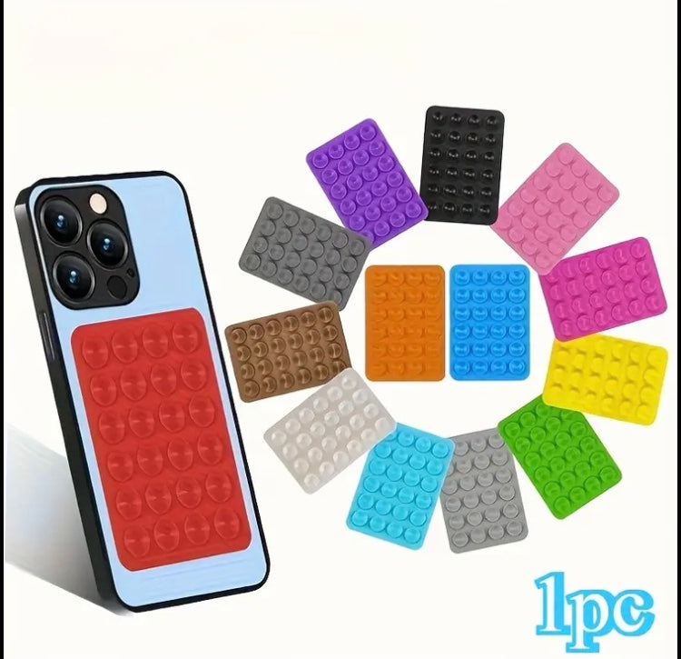 24 Compact Silicone Phone Holders with Suction Cups, Designed for Smartphones And Compatible with Different Surfaces. They Are Sturdy, Waterproof, Easy to Apply, And Have a Non-Slip Feature.