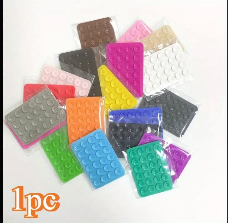 24 Compact Silicone Phone Holders with Suction Cups, Designed for Smartphones And Compatible with Different Surfaces. They Are Sturdy, Waterproof, Easy to Apply, And Have a Non-Slip Feature.