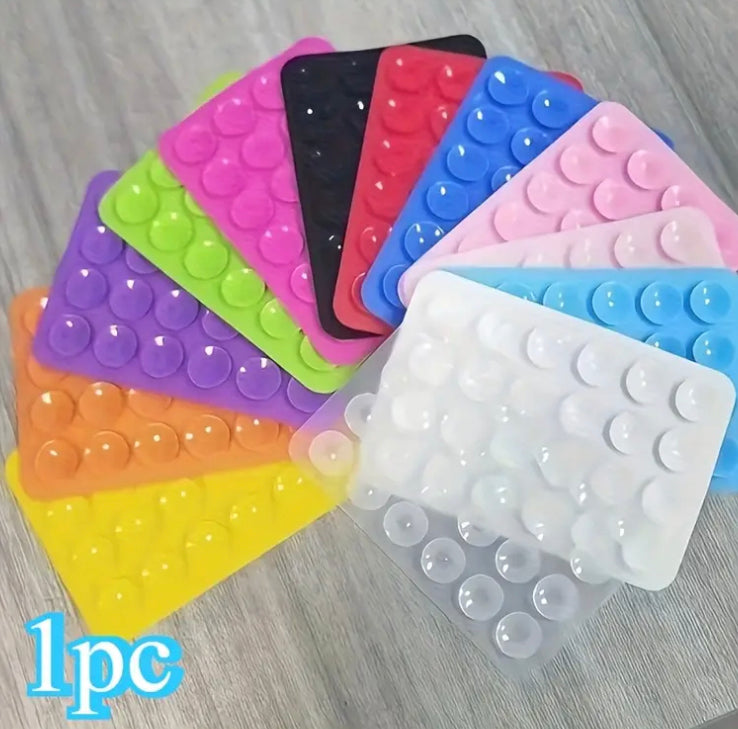 24 Compact Silicone Phone Holders with Suction Cups, Designed for Smartphones And Compatible with Different Surfaces. They Are Sturdy, Waterproof, Easy to Apply, And Have a Non-Slip Feature.
